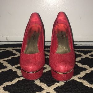 Red and gold platform heels